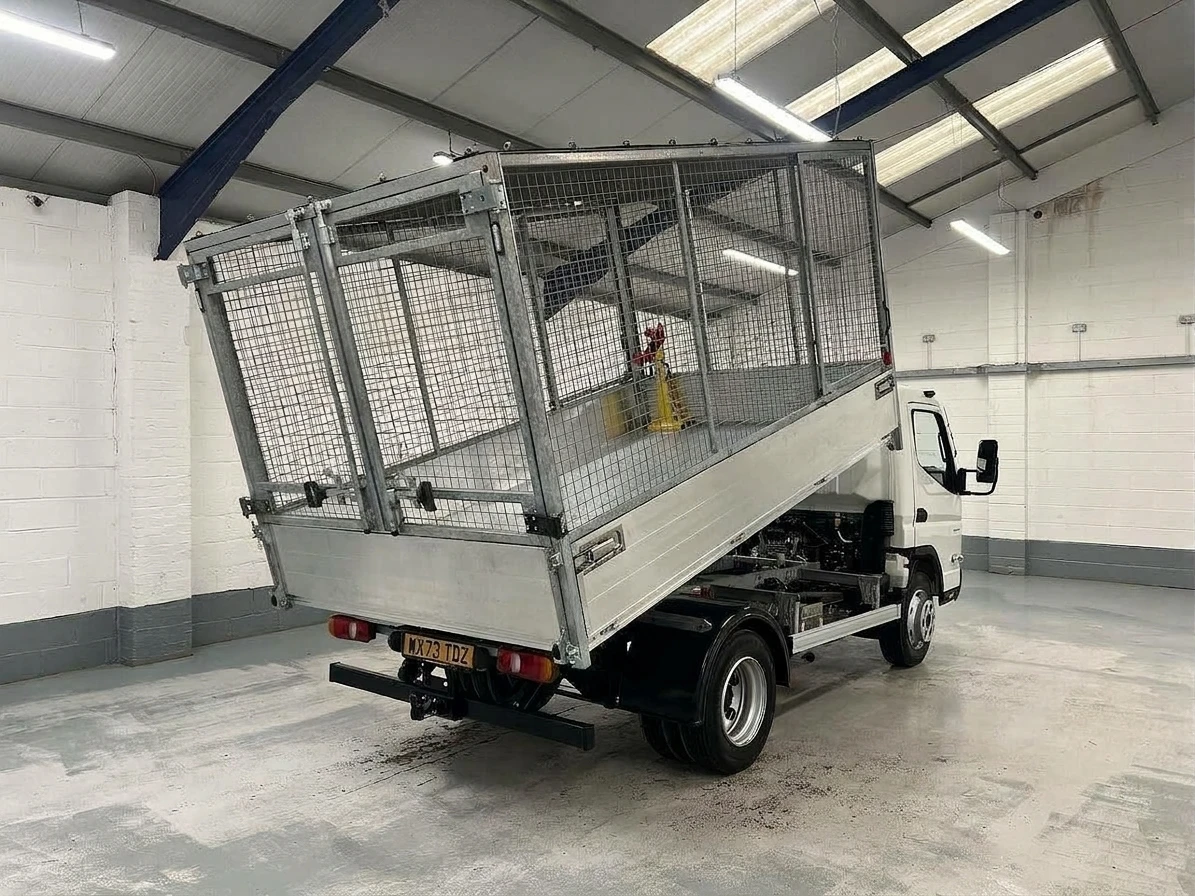 2023 Fuso Canter Tipper Van — rear three-quarter view