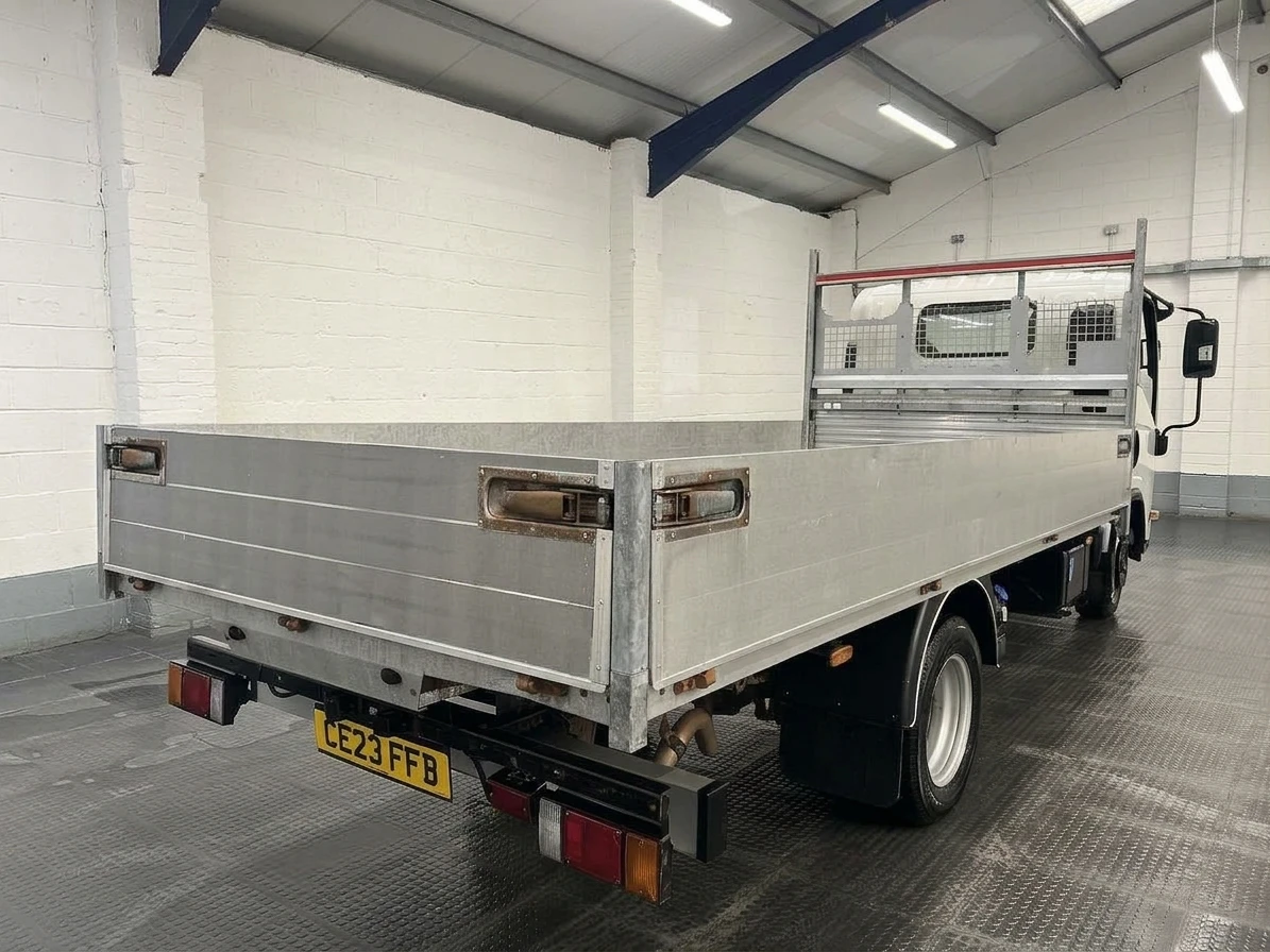 2023 Isuzu Grafter Dropside Van — rear three-quarter view