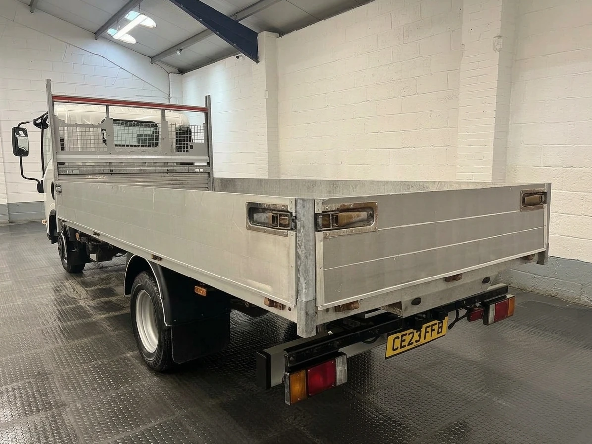 2023 Isuzu Grafter Dropside Van — rear three-quarter view