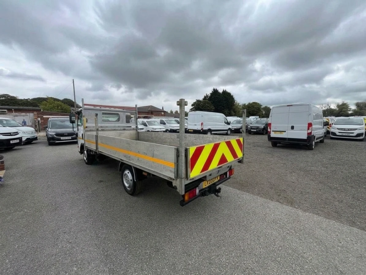 2023 Isuzu Grafter Dropside Van — rear three-quarter view