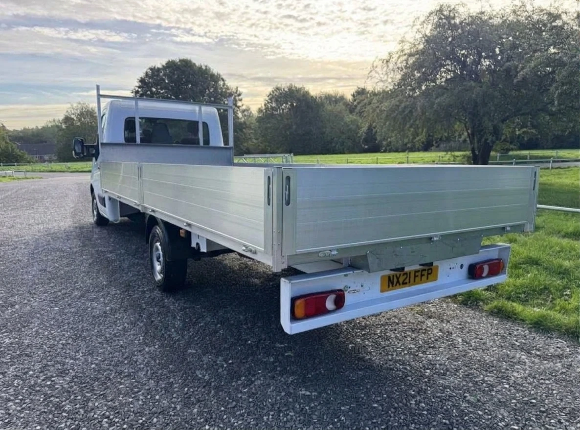 2021 Nissan NV400 Dropside Van — rear three-quarter view
