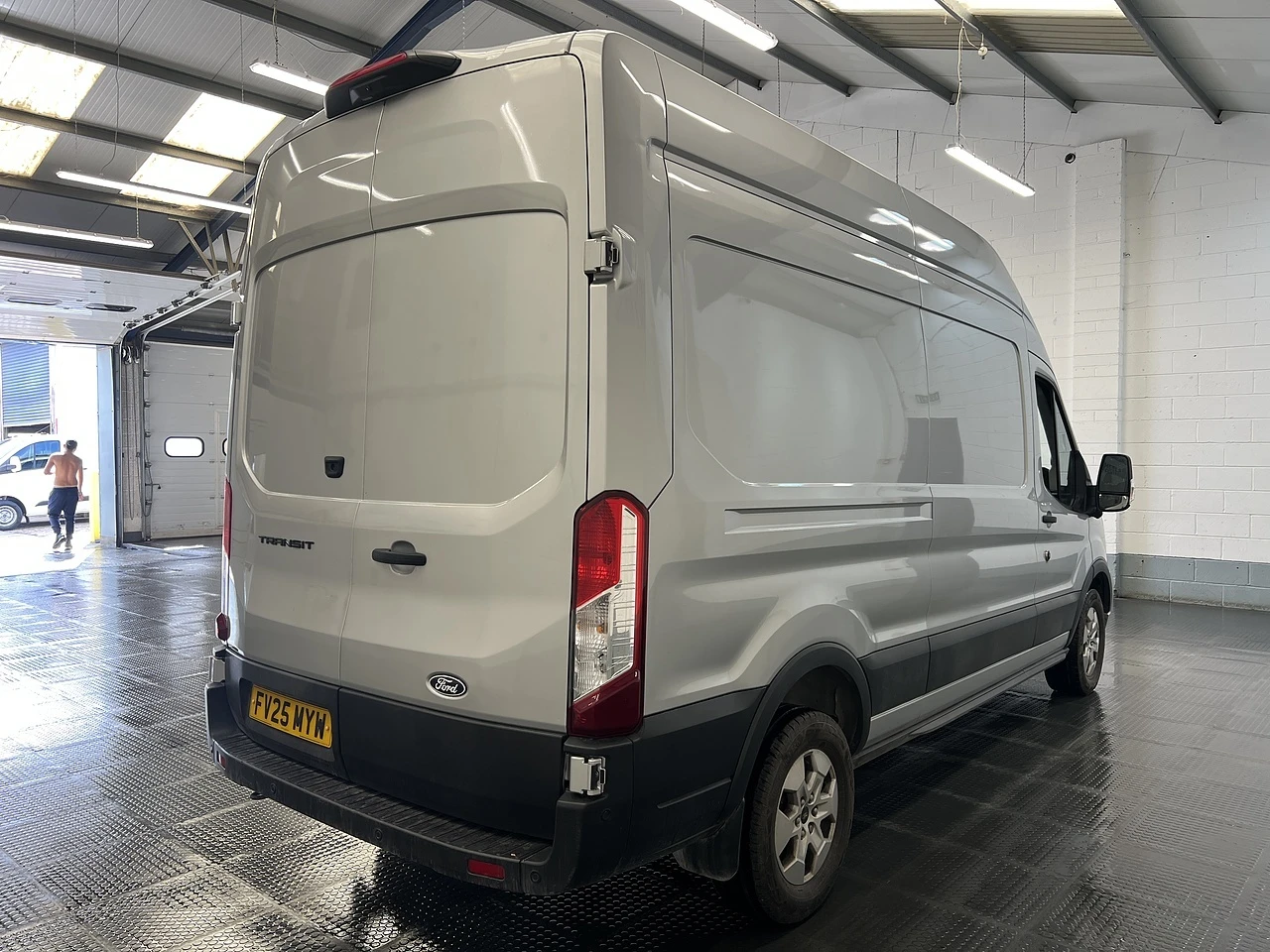 2025 Ford Transit High Roof Panel Van — rear three-quarter view