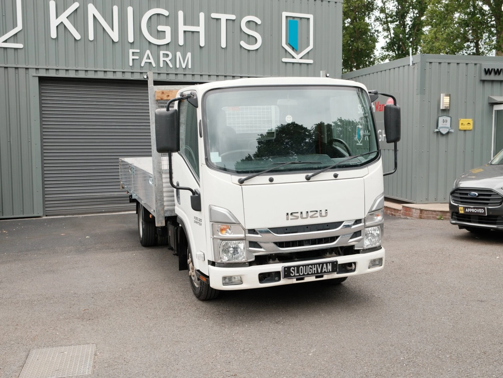 2024 Isuzu Grafter Dropside Van — front three-quarter view
