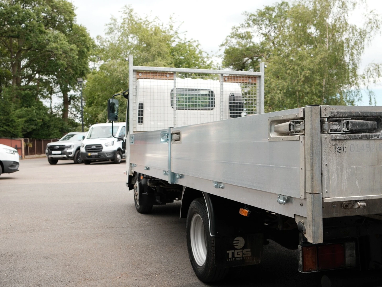 2024 Isuzu Grafter Dropside Van — rear three-quarter view